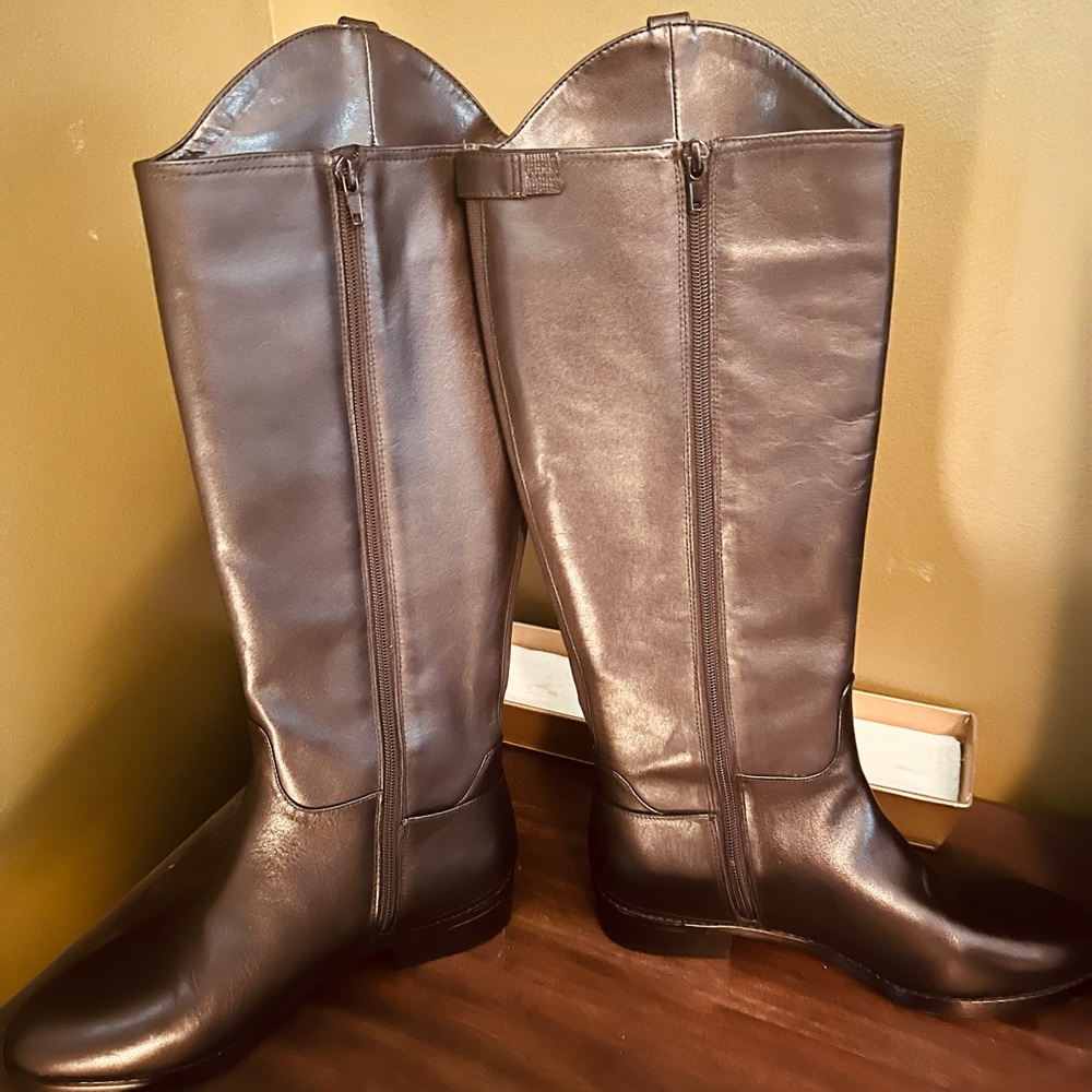 NWOT INC black leather riding boots. Wide calf and never been worn